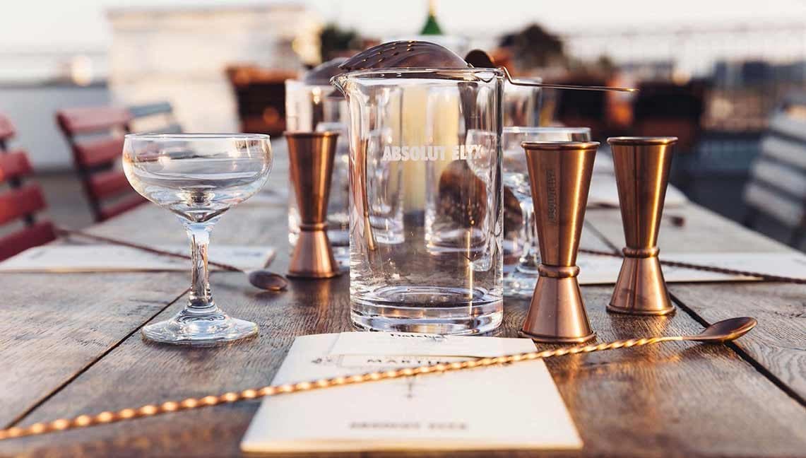 Absolut Elyx cocktail with copper cups at sunset
