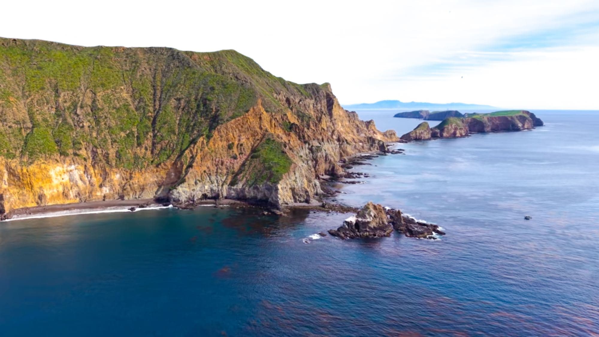 Channel Islands cliffs above a calm blue sea